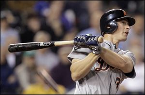 Detroit's Don Kelly hits a two-run home run in the eighth inning last night against Kansas City.
