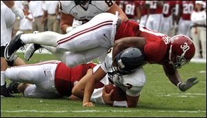Alabama linebacker Dont'a Hightower sacks Kent State quarterback Spencer Keith. The Southeastern Conference has five teams ranked in the top 15.
