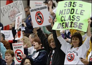 Protestors against Senate Bill 5 gather at the Ohio Statehouse for a rally launching the 