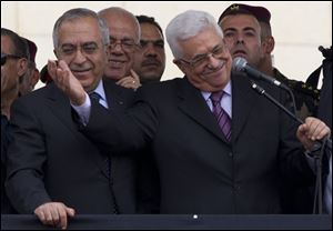 Palestinian leader Mahmoud Abbas, with his arm extended, tells supporters on the West Bank that they are part of a ‘Palestinian spring.’