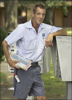 Letter carrier Keith McVey, seen here in July 2010, is a 30-year veteran of the United States Postal Service.
