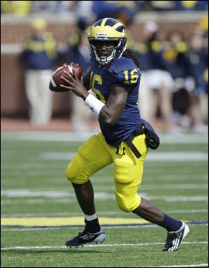 Michigan quarterback Denard Robinson (16) looks to pass during the second quarter of a college football game against Minnesota in Ann Arbor, Mich., Saturday.
