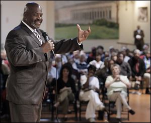 Mayor Mike Bell speaks during a meeting of the minds for the 