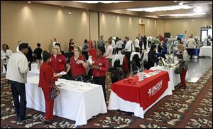 The Pinnacle in Maumee is swarmed with job seekers during a job fair for job seekers 50 years old and above on October 4, 2011.