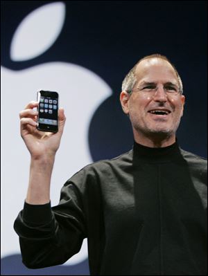 Steve Jobs introduces the Apple iPhone during his keynote address at MacWorld Conference & Expo in a San Francisco in 2007.