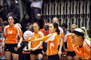 Bowling Green State University volleyball player Madi Nitta prepares to serve during  a Falcons' match. Nitta spent her summer playing for the USA Deaf Volleyball team that won the 2011 Friendship Games at Gallaudet University in Washington.