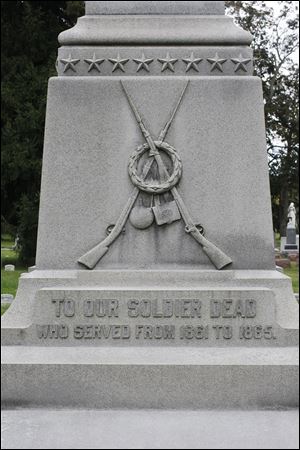 The base of the Civil War monument, dedicated in 1901, bears an inscription honoring the dead who served from 1861 to 1865. The granite monument  is surrounded by  295 graves laid out in the shape of a five-pointed star.