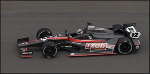 Dan Wheldon test drives the 2012 IndyCar at the Indianapolis Motor Speedway in Indianapolis last month.