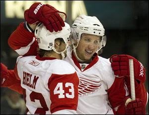 Detroit Red Wings' Justin Abdelkader, right, celebrates his goal with teammate Darren against the Toronto Maple Leafs during first period preseason NHL hockey action in Toronto on Saturday, Oct. 1, 2011. 