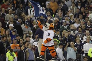 Paws, the Detroit Tigers mascot, rallies the crowd during the seventh inning of Game 4 of baseball's American League division series against the New York Yankees Tuesday in Detroit.