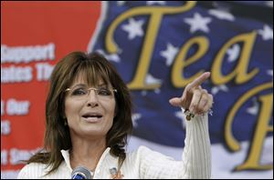 Former Alaska Gov. Sarah Palin speaks to Tea Party members during the Restoring America event, Saturday, Sept. 3, 2011, in Indianola, Iowa.