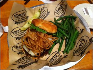 The Shorty’s Burger with green beans at Shorty’s True American Roadhouse.