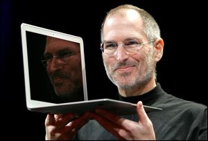 Jobs holds up the new MacBook Air in Jan., 2008.