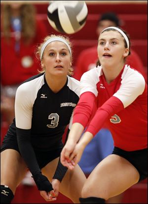 Aricka LaVoy, left, and Brooke Salazar move in to make a play. LaVoy leads the Eagles with 239 digs. Salazar is second on the team with 93 kills.