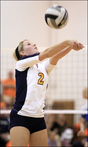 Notre Dame's Lisa Urbanski sets the ball during the first game against the top-ranked Arrows. The Eagles fell in four sets.