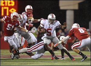 Ohio State’s Braxton Miller works his way through the Nebraska defense. He was later injured in the Cornhuskers’ first Big Ten home game.