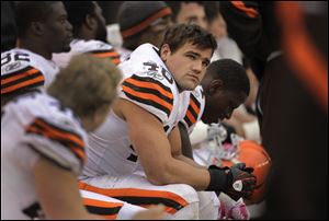 Cleveland Browns running back Peyton Hillis sits on the bench late in the team's 31-13 loss to the Tennessee Titans in an NFL football game in Cleveland.