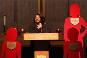 Cheryl Rucker, speaks to the crowd at the Maumee United Methodist Church during the traveling Silent Witness Project, which represents women in northwest Ohio who were killed by domestic violence. Ms. Rucker's daughter Shynerra grant was among those recognized.