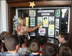 Students from Custer Elementary School in Monroe learn about General George Armstrong Custer from Teacher Kelly Lake.