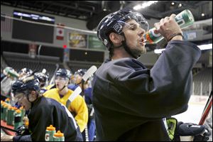 Simon Danis-Pepin takes a drink during practice. He was a second-round draft choice by Chicago in 2006.