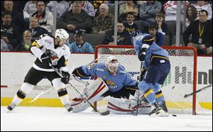 Walleye goaltender Thomas McCollum stops a shot by Cincinnati's Dan Eaves, left, in a game last season. McCollum was the Detroit Red Wings' No. 1 draft pick in 2008.