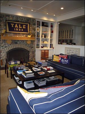 Betsy Burnham suggests decorating your TV room with just one of your team's colors to give a nod to the team without going overboard, in this case blue for Yale.