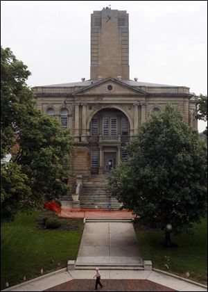 A redevelopment group proposes to do exterior work on the building at no charge for a year.