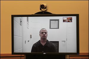 Cameo Pettaway, a prisoner in the Lucas County Jail, is arraigned in Sylvania Municipal Court on two counts of murder and one count of aggravated robbery. He is the second person to be arrested for the deaths of Johnny Clarke, 21, and Lisa Straub, 20, in Miss Straub's parents' Longacre Lane home Jan. 31.