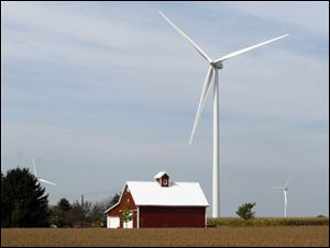 Three wind turbines on farmland in Benton Township are among several in Paulding County.