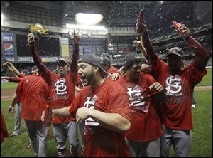 The Cardinals celebrate after winning the NLCS. Wild-card St. Louis didn’t even qualify for the postseason until the season’s final day.