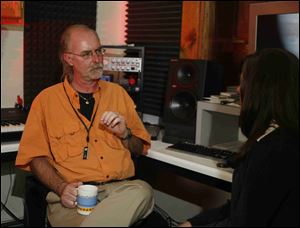 Dave Mariasy, center, being interviewed by Breanne Democko, right, about using audio technology to solve crimes. 