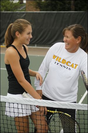 The Blade/Sean WorkMegan Millerand her mother, Susie Miller, share a laugh at Northview High School's tennis courts in Sylvania. Susie is Megan's coach in addition to being her mother.