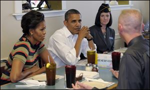 President Barack Obama and first lady Michelle Obama have lunch Wednesday with veterans at Annapolis's Pizza and Italian Kitchen in Hampton, Va.