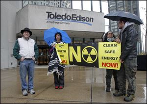 Attorney Terry Lodge and other protestors demonstrate Wednesdayoutside the Toledo Edison building at Levis Square in downtown Toledo. 