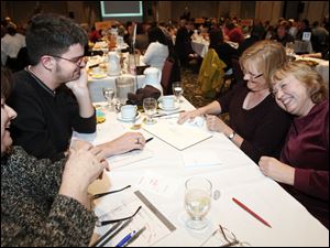 Left to right Sandy Norton, Todd Huss, Alma Reising, and Veronica Hughes of Root Learning win the 24th annual Blade Corporate & Community Spelling Bee Thursday at the Park Inn in Toledo.