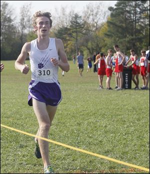 Maumee's Willy Fink won his first district championship in 16:20.7.