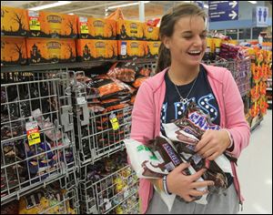 Samantha TenEyck, 17, loads up on candy, even though prices have gone up.