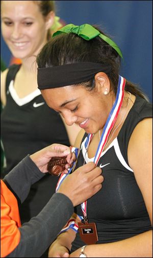 Ottawa Hills' Shivani Bhatt, front, and Nancy Rumpf receive their state fourth-place medals.
