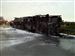 turnpike-crash-car-hauler.jpg The charred remains of a car hauler rests on its side in the westbound lanes of the Ohio Turnpike just east of the Albon Road overpass.