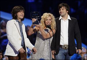 From left to right, Reid, Kimberly and Neil Perry from The Band Perry are in the running for best vocal group at the Country Music Awards on Nov. 9 on ABC.