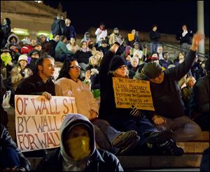 Protesters affiliated with the Occupy Wall Street Movement gather Friday night at the Tennessee Capitol in Nashville.