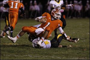 Northview running back Pete Cook, 44, pulls down Southview quarterback Austin Valdez by his jersey at Northview.
