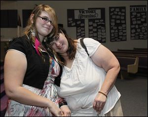 Kelsey Ball, 16, left, and her mom, Colleen Ball, reflect after speaking at an event sponsored by the Toledo Area Alliance to End Homelessness at Friendship Baptist Church in South Toledo. It was the first time Kelsey spoke publicly about her experiences being homeless.