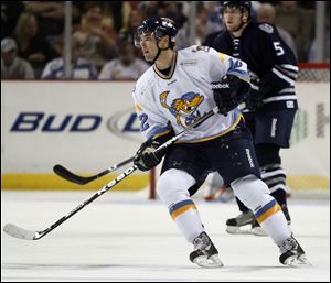 Toledo Walleye player Aaron Lewicki, 12, skates against the Chicago Express in an ECHL opener at Huntington Center, Saturday. 