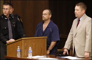 Rick VanLandingham III, center, with public defender Jim Neumeyer, right, is arraigned in Toledo Municipal Court.