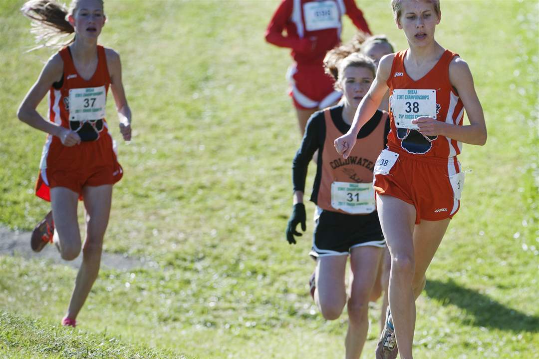 Liberty-Center-runners-Kelly-Haubert-38-and-Paige-Chamberlain-stick-together-near-the-2-mile-marker