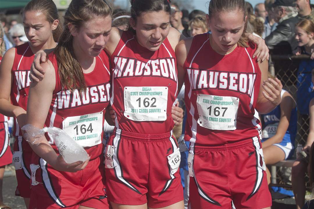Wauseon-runners-Tessa-Herring-left-Aleea-Volkman-right-give-teammate-Jessica-Bachman-a-lift