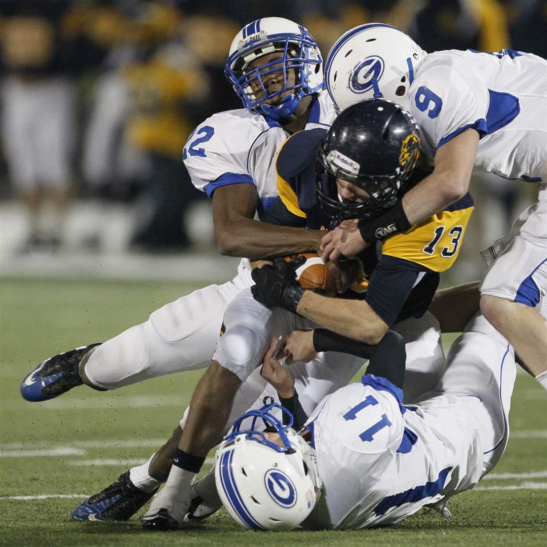 Whitmer-s-Verroco-13-is-tackled-by-AW-s-Omofoma-Chipka-and-Schwerer