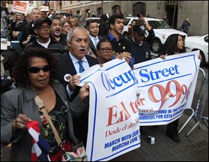 Occupy Wall Street protesters march around Zuccotti Park on Monday in New York. 