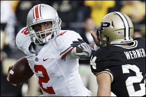 Purdue linebacker Jason Werner chases down Ohio State quarterback Terrelle Pryor during a 2009 game in West Lafayette, Ind.